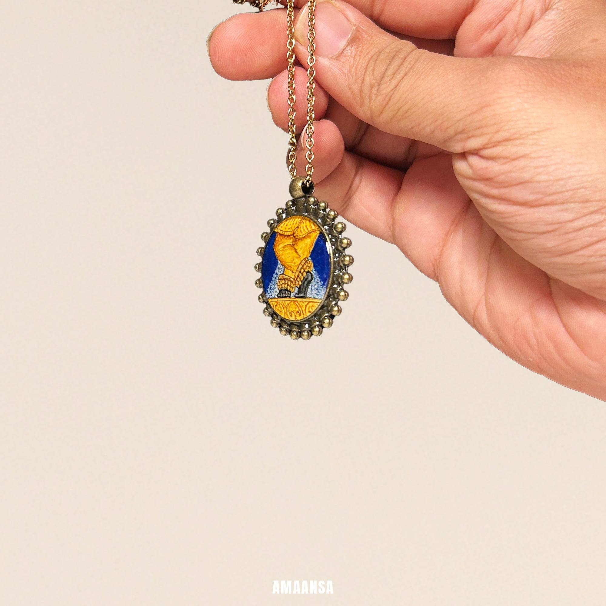 Hand holding a necklace with a detailed pendant against a beige background. Custom deity locket handpainted Radha Ramana miniature art full color vintage pendant spiritual jewelry devotional necklace divine protection religious keepsake heirloom collectible