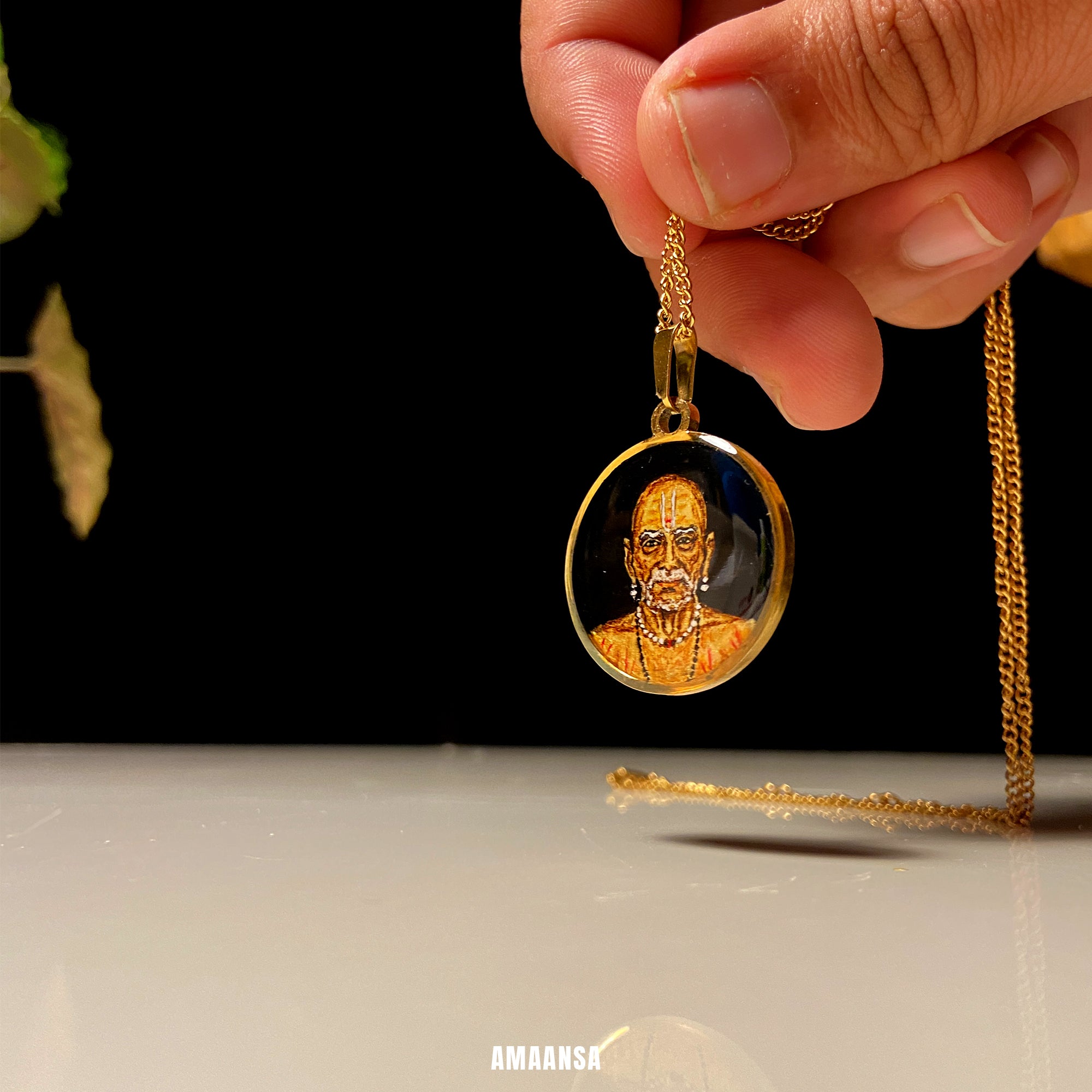 Gold necklace with a pendant featuring an engraved portrait on a dark background. 18k gold PVD locket handpainted Swami Samarth monochrome miniature portrait pendant gold background spiritual jewelry devotional keepsake guru saint art collectible divine blessing necklace