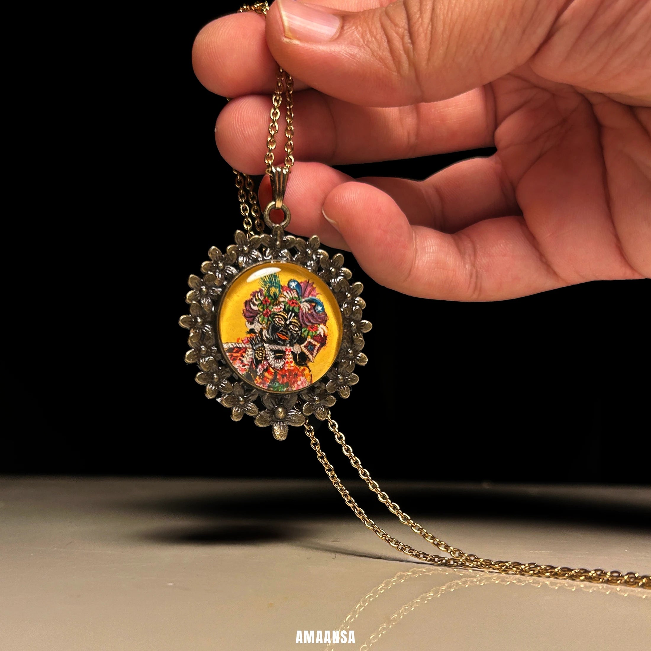 Close‑up of Banke Bihari pendant showing tilted stance and flute, devotional Krishna art jewelry.