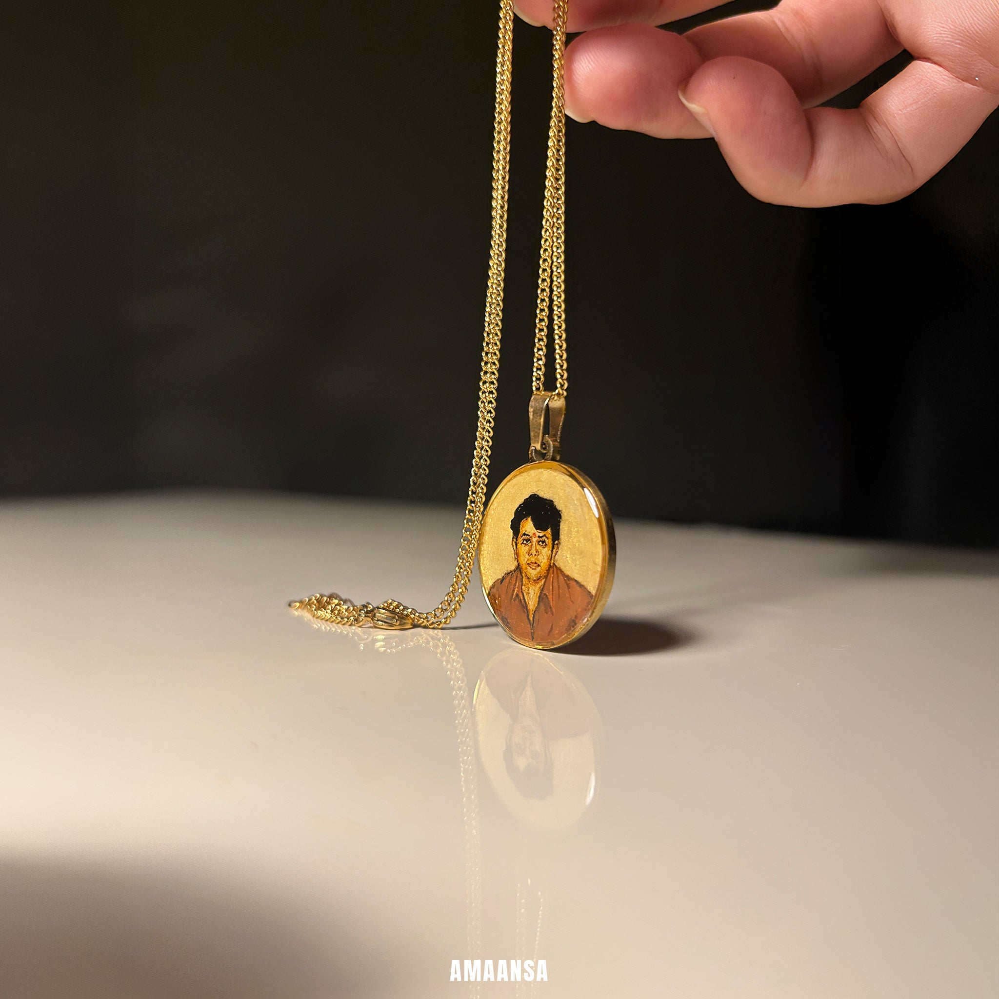 Gold necklace with a pendant featuring a portrait on a reflective surface. Memorial 18k gold pendant lost father handpainted miniature art black white photo reference childhood memory luxury jewelry monochrome painting burnt umber technique stainless steel remembrance treasure piece