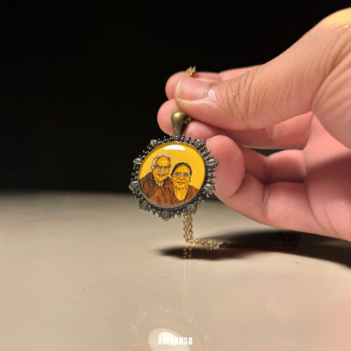 Hand holding a pendant with a portrait on a dark background. Custom vintage two-face pendant parents portrait aged metal finish handpainted miniature art doctors tribute heirloom keepsake son commissioned wearable legacy token