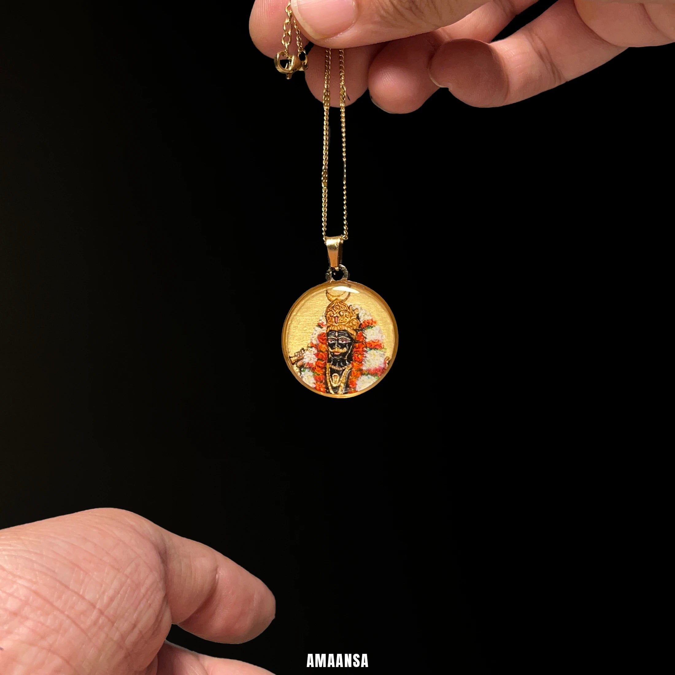 Kaal Bhairava 18k gold‑plated pendant with hand‑painted deity and marigold garlands, devotional necklace held upright to show detailed miniature.