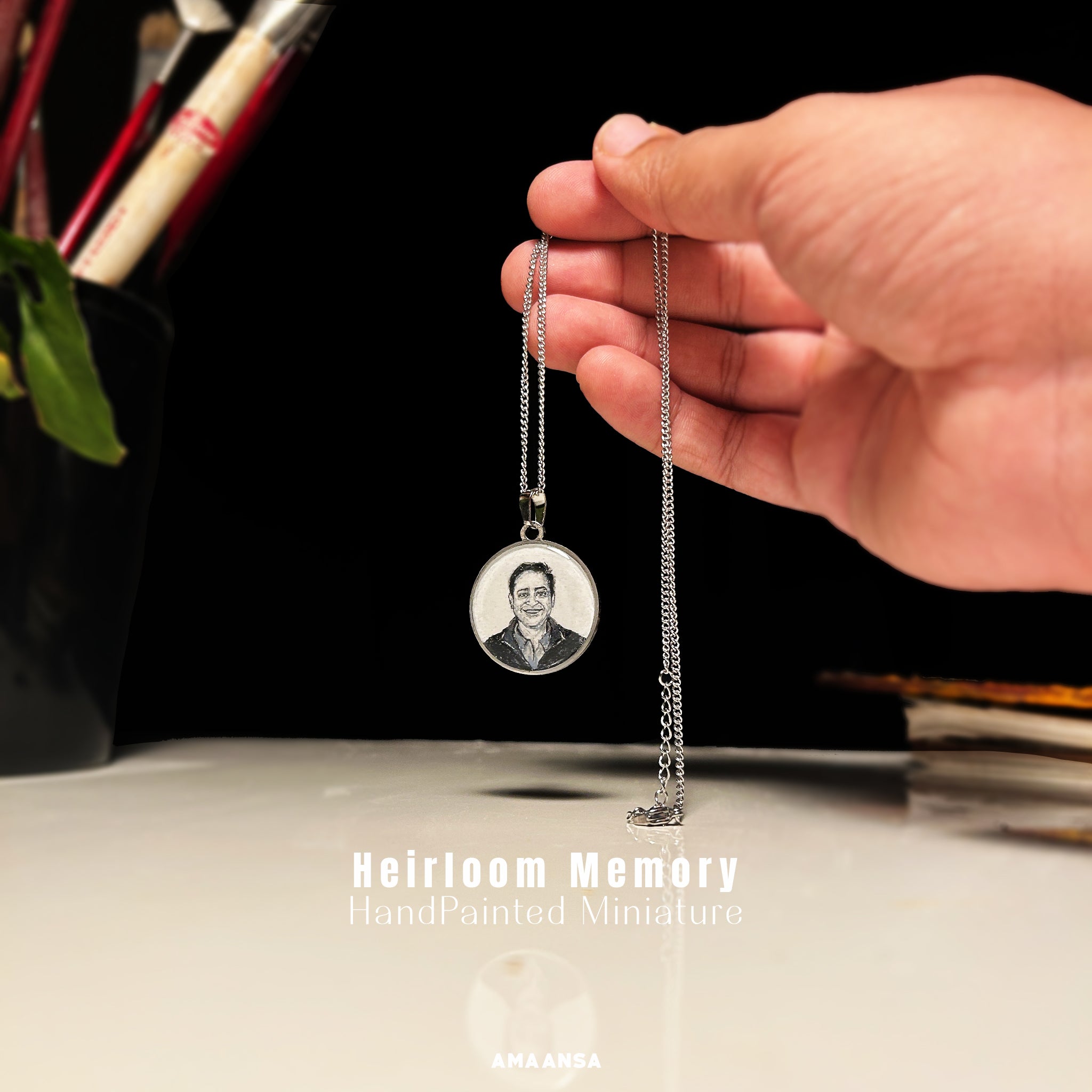 "Heartfelt memorial keepsake in 26mm rhodium-finished pendant - son's charismatic smile and gentle eyes eternalized for his mother, commissioned by his caring friend, artist Abhinav capturing his vibrant spirit through precise brushwork - from his warm, genuine expression to the subtle details of his formal attire, delicately rendered in monochromatic tones against silver backdrop, pendant's intimate scale demonstrated through gentle hold against artist's workspace"
