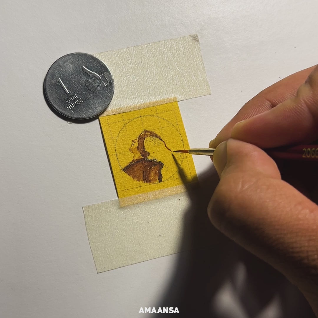 Artist from AMAANSA Fine Arts Studio hand-paints a detailed miniature portrait inspired by the movie 'Call Me by Your Name.' The video features close-up shots of the artist’s brush strokes on the pendant while Sufjan Stevens' music from the movie plays in the background. The pendant represents the Pride Collection, celebrating love and inclusivity