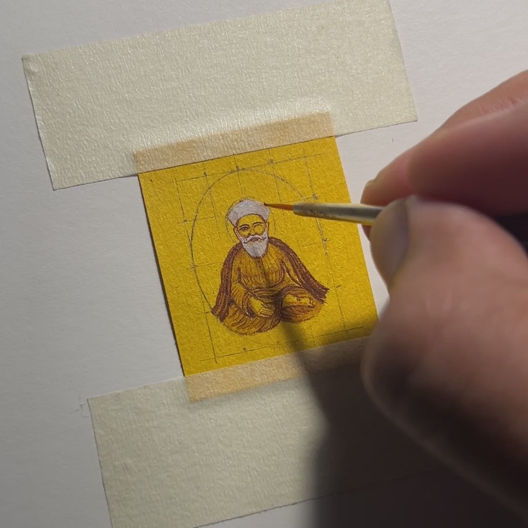 In this video (24 sec), the artist from AMAANSA Fine Arts Studio meticulously paints a miniature portrait of Guru Nanak ji, capturing his serene meditative pose and divine glow. The artist carefully works on the fine details of the 26mm x 32mm oval canvas, bringing to life Guru Nanak ji's peaceful expression and the halo surrounding his head. Set against a black background, the painting unfolds in real time, showcasing the precision and artistry involved in creating this wearable piece of spiritual art.