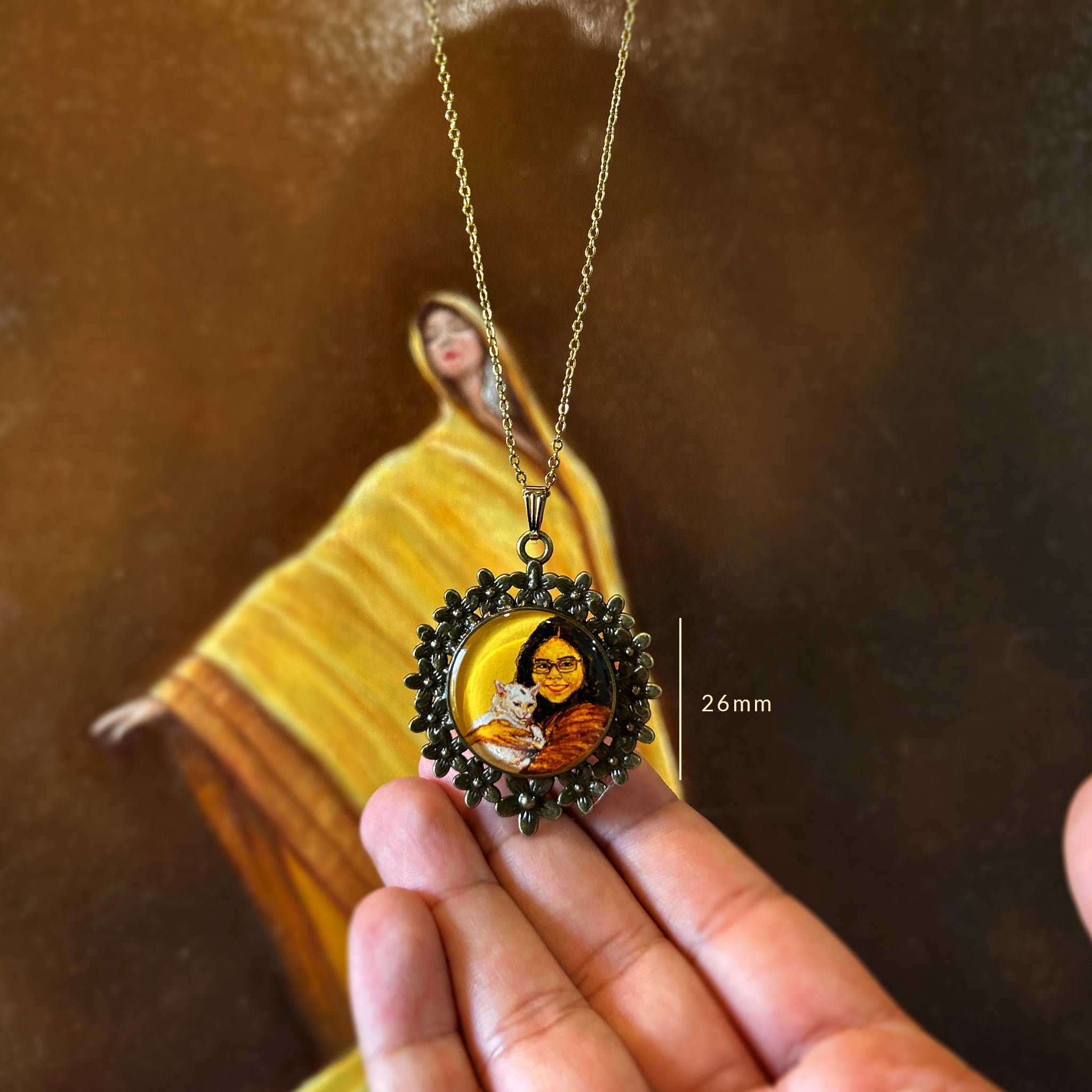 Hand-painted miniature pendant (26mm) immortalizing unbreakable pet bond: young woman tenderly cradling her cherished white cat against her chest, their deep connection evident in her gentle smile and protective embrace, while her companion nestles trustingly in her arms. Portrait set in ornate vintage-styled floral frame, hanging delicately against ethereal golden painting, preserving this treasured relationship where every brushstroke captures their shared love & comfort, finished with dimensional coating