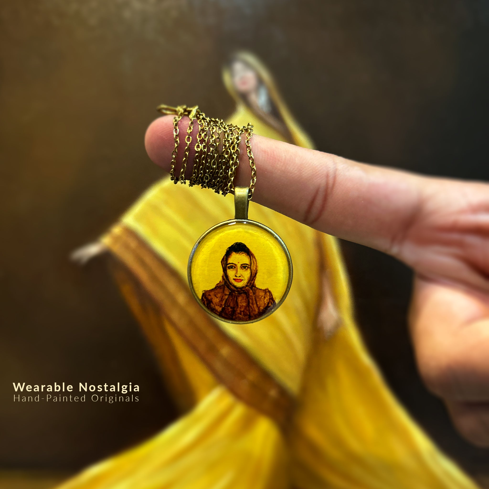 AMAANSA's artisan miniature art pendant (26mm), bringing life to a treasured black and white photograph from the 1970s. Mother's warm expression and classic headscarf captured in rich brown tones with timeless appeal. Elegantly bordered in minimalist brass frame design. Artfully presented with antique gold colored chain delicately coiled, against artist's original oil painting backdrop. Sealed with luminous protective layer, this nostalgic jewelry piece keeps cherished memories close.